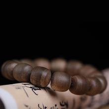 Load image into Gallery viewer, Wild Agarwood Bracelet from Cambodia 99% sinking grade Kynam 12mm Beads
